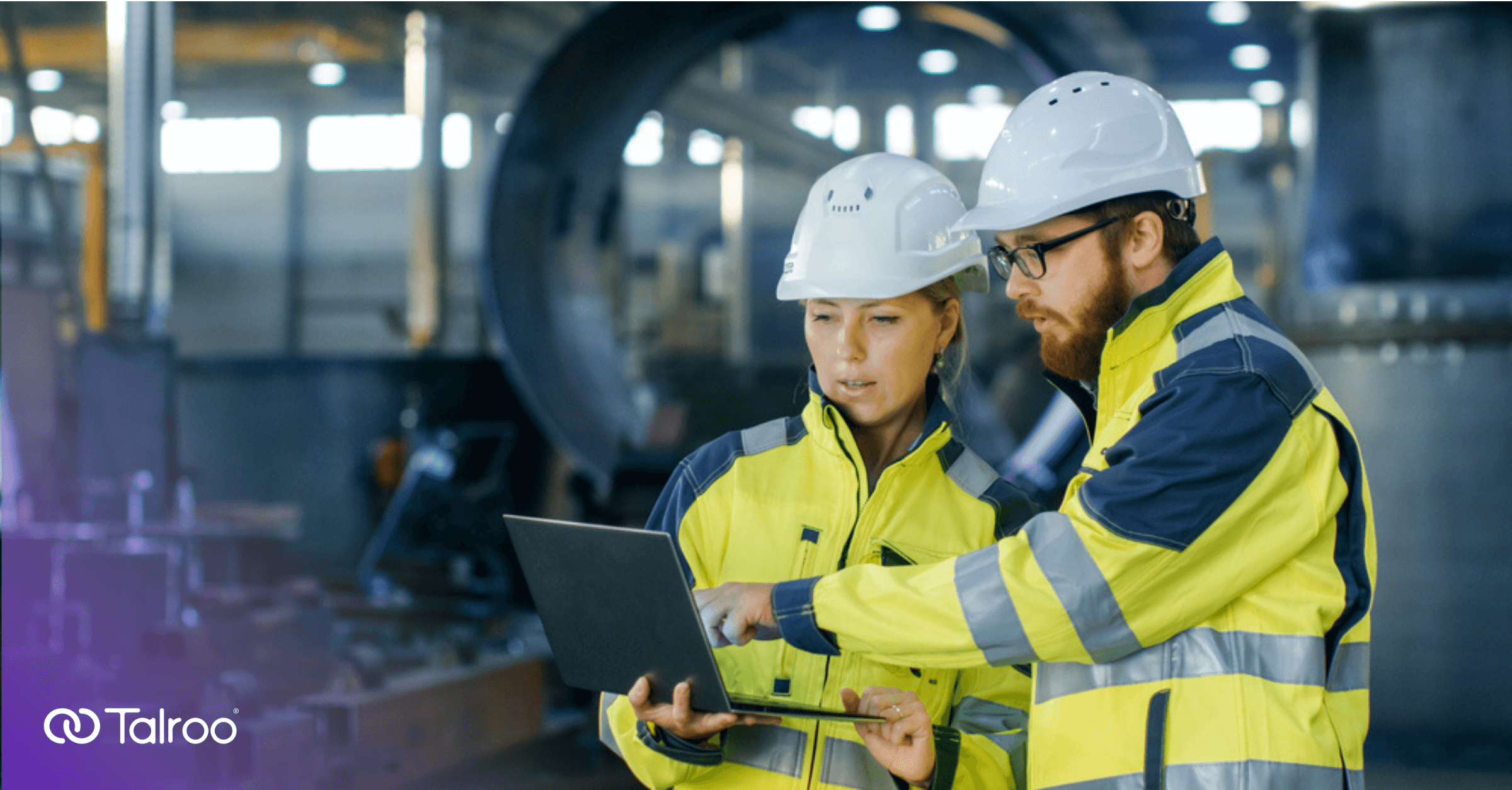 Workers looking at a laptop